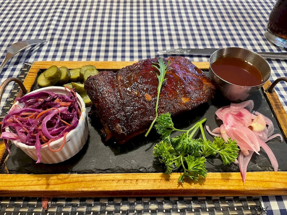 Australian steaks at Butcher Steak are perfectly grilled and served with creamy salad